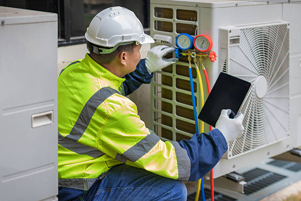 Professional Air Duct Cleaning technician working in Eaton Park, FL